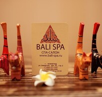 Визитная карточка BALI SPA и деревянные фигурки